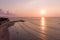 Sunset Beach in Bali, Indonesia. Badung City. Ocean Water and Tourists in Background. Popular Spot Among Tourists and Local People