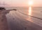 Sunset Beach in Bali, Indonesia. Badung City. Ocean Water and Tourists in Background. Popular Spot Among Tourists and Local People