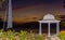 Sunset at the beach with the catamaran and gazebo