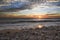 Sunset on the beach on the coast of France over the Atlantic Ocean, sea landscape. Plage de Pen Hat in France