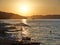 Sunset on the beach in the Croatian town of Okrug Gornji. Sailing ship on the background of mountains