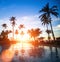 Sunset at a beach luxury resort in tropics. Travel.