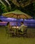 sunset on the beach in Mauritius, luxury restaurant with umbrella and chairs on the beach for dinner