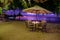 sunset on the beach in Mauritius, luxury restaurant with umbrella and chairs on the beach for dinner