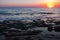Sunset beach ocean wave splash. rock seascape
