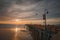 Sunset on the beach and pier. An iconic California wooden pier at 1, 370 feet long in the heart of Pismo Beach city in Central Cal