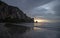 Sunset beach reflections at Morro Rock on the central coast of California at Morro Bay California USA