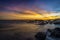 Sunset on the beach with rock islet