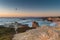 Sunset in beach with rocks in Porto Covo in Alentejo, Portugal