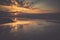 Sunset on beach with a wooden breakwater in Leba, Baltic Sea, Po