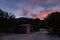 Sunset with beautiful afterglow with a toilet in the campground