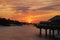 Sunset with beautiful natural sky against the overwater villa at a tropical resort island, Maldives