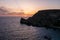 Sunset on a beautiful spring day with calm sea, seen from Anchor Bay, Mellieha, Malta.