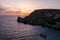 Sunset on a beautiful spring day with calm sea, seen from Anchor Bay, Mellieha, Malta.