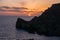 Sunset on a beautiful spring day with calm sea, seen from Anchor Bay, Mellieha, Malta.