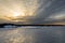 Sunset. Beautiful view of the northern snow covered shores of Scandinavia, Baltic sea at sunset