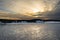 Sunset. Beautiful view of the northern snow covered shores of Scandinavia, Baltic sea at sunset