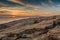 Sunset behind Cadillac Mountain Acadia National Park as seen from Schoodic Point