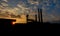 The sunset behind chimney towers is silhouette picture