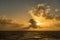 Sunset behind a cruising cruise ship at sea