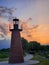 Sunset behind lighthouse at Lakefront park