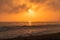 Sunset behind the Malibu Hills and the Pacific Ocean with Breaking waves