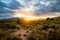 Sunset behind the mountains with atmospheric clouds