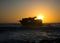 Sunset behind shipwreck near cape agulhas