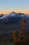 Sunset behind smoky volcano mountain, Indonesia