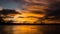 Sunset behind a tiny boat at the amazon river