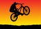 Sunset bicycle jumping