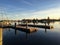 Sunset at a boat dock, reflections on the water