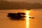 Sunset and boat with floating house