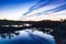 Sunset in the bog, golden marsh, lakes and nature environment. Sundown evening light in spring.