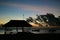 Sunset with bungalow and moon on Flic en Flac Beach on Mauritius