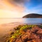 Sunset in Cala Violina bay beach in Maremma, Tuscany. Mediterranean sea. Italy.