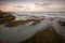 Sunset on calm beach slow shutter seascape