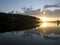 Sunset on the calm forest lake