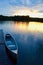 A sunset, a canoe, and a tranquil lake