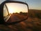 Sunset on car mirror