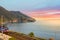 Sunset on the Cinque Terre as the train heads into the Corniglia railway station on the coast of Italy