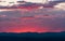 Sunset and clouds over dark mountains at Dinosaur National Monument