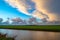 Sunset clouds over the Dutch polder landscape