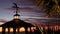 Sunset cloudscape, gazebo on beach, twilight dusk, dramatic sky. Alcove and vane