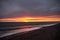 Sunset with a cloudy sky on the beach