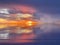 Sunset cloudy starry night dark dramatic blue lilac gold orange sunset at sea water reflection boat on horizon in harbor nature la