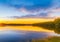 sunset at the coast of the lake. Nature landscape. Nature in Northern Europe. reflection, blue sky,