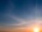 Sunset and colored cirrus clouds on a bright blue sky