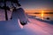 Sunset colored snowy stones