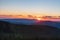 Sunset with colorful sky from Dlouhe strane hill in Jeseniky mountains in Czech republic